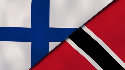Fototapeta premium The flags of Finland and Trinidad and Tobago. News, reportage, business background. 3d illustration
