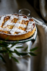 Preparation of Easter cake, also called Pastiera Napoli, typical homemade dessert, with eggs, flour, sugar and vanilla, wheat and colored sugared almonds