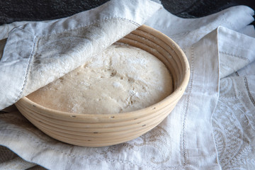 Bread dough rising in basket, home made
