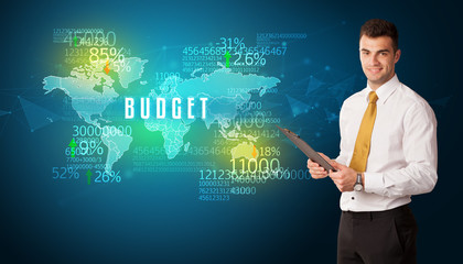 Businessman in front of a decision with BUDGET inscription, business concept