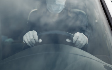 Woman in protective suit, medical mask and rubber gloves for protect from bacteria and virus is...