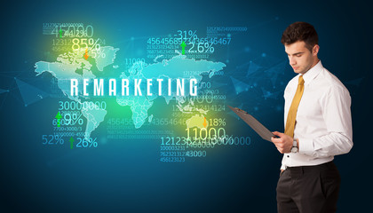 Businessman in front of a decision with REMARKETING inscription, business concept