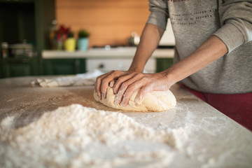 woman hands kneading dough - Powered by Adobe