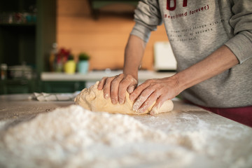 woman baker kneading dough