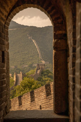 Peeking through a doorway of one of the 25,000 watch towers of the Great Wall of China near Beijing, China.