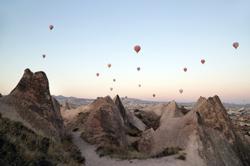 Göreme, Turkey - 09/20/2019: View from the observation deck of the Red Valley on the flight of balloons over the valleys of Cappadocia.