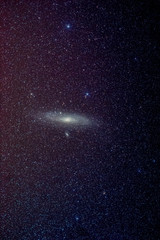 Andromeda galaxy over light polluted area