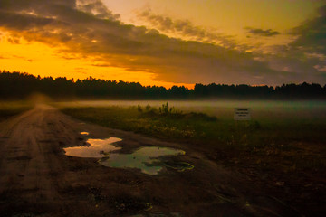 Road to sunset and fog