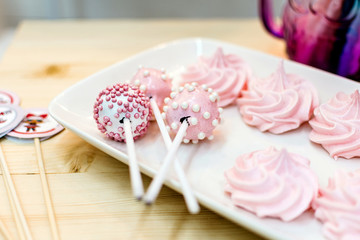 Candies and dessert on a wooden table