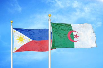 Philippines and Algeria two flags on flagpoles and blue cloudy sky