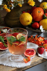 Orange cocktail and fresh strawberries
