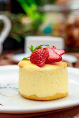 cheesecake with wild berries on a white plate