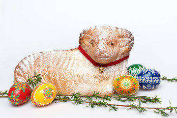Beautiful baked Easter Lamb cake and Easter hand painted eggs, typical Czech Easter decoration on white background