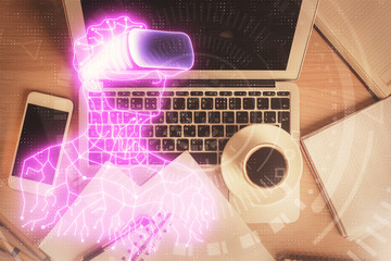 AR hologram drawings over computer on the desktop background. Top view. Multi exposure. Concept of augmented reality.