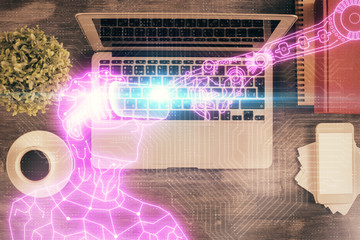 AR hologram drawings over computer on the desktop background. Top view. Multi exposure. Concept of augmented reality.