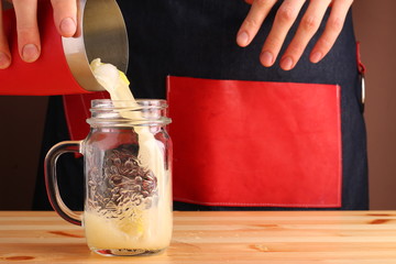 male bartender make citrus cocktail. non alcoholic summer drinks with citrus on wooden table