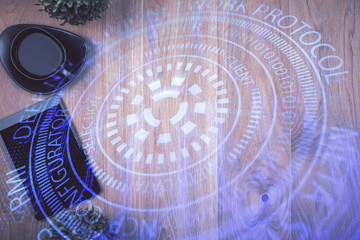 Double exposure of technology theme drawing over work table desktop. Top view. Global data analysis concept.