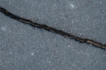 Asphalt with one large crack