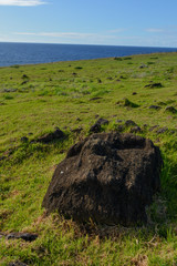 Green landscape with buried ruins at Vinapu, Rapa Nui, Easter Island