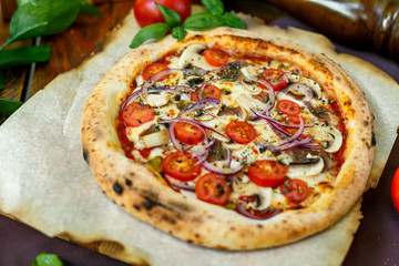 pizza with mozzarella cheese with tomatoes red onion and tenderloin