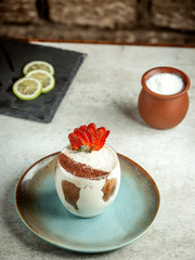 creamy dessert with sliced strawberries