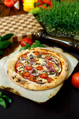 pizza with mozzarella cheese with tomatoes red onion and tenderloin