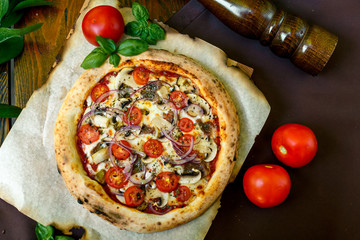 pizza with mozzarella cheese with tomatoes red onion and tenderloin