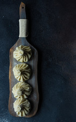 Traditional georgian khinkali dish on stone background