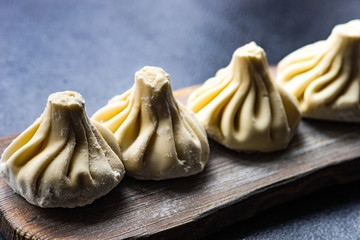 Traditional georgian khinkali dish on stone background