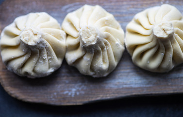 Traditional georgian khinkali dish on stone background