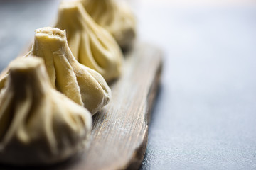 Traditional georgian khinkali dish on stone background