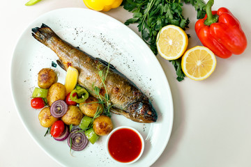 rainbow trout with grilled vegetables and citrus sauce