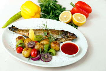 rainbow trout with grilled vegetables and citrus sauce