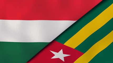 The flags of Hungary and Togo. News, reportage, business background. 3d illustration