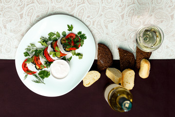 fried eggplant with tomatoes and greens under sauce with wine