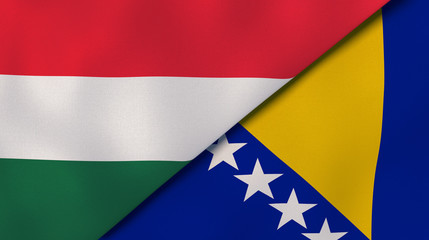 The flags of Hungary and Bosnia and Herzegovina. News, reportage, business background. 3d illustration