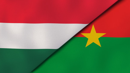 The flags of Hungary and Burkina Faso. News, reportage, business background. 3d illustration