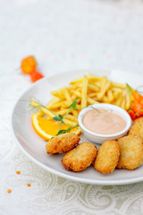 nuggets with French fries and sauce