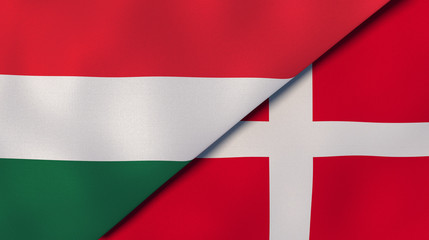The flags of Hungary and Denmark. News, reportage, business background. 3d illustration
