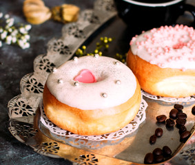 donuts with cream and candies on top