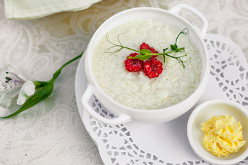 breakfast, rice porridge with butter, fruits and berries