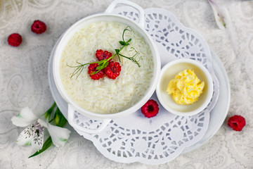 breakfast, rice porridge with butter, fruits and berries