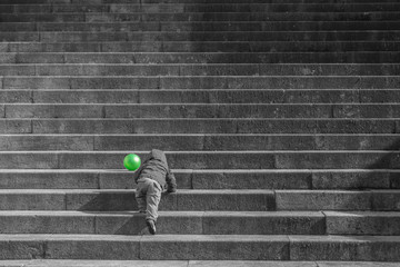 child climbing stairs step by step - motivation, perseverance, persistence, goals