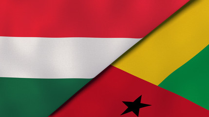 The flags of Hungary and Guinea Bissau. News, reportage, business background. 3d illustration