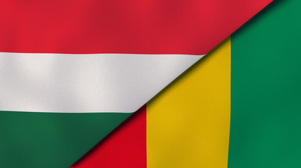 The flags of Hungary and Guinea. News, reportage, business background. 3d illustration
