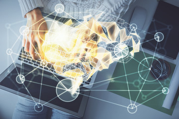 Double exposure of woman working on computer andhuman brain hologram drawing. Top View. Ai concept.