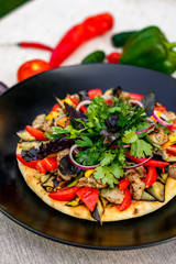 salad with meat greens and vegetables grilled on a wheat cake with smoke