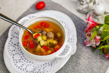 soup with vegetables and meatballs for lunch