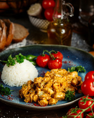 fried chicken in sauce with rice