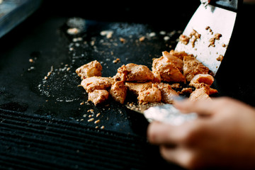 fried chicken pieces on grill